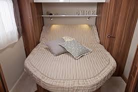 The island bed can be entered from both sides. its the closest in design to a proper double bed