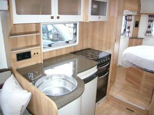 The Kitchen is compact but spacious enough to get past to the loo or bedroom if one of you is preparing a meal 